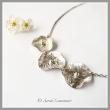Appréciez la douceur de ce délicat collier de fleur en argent réticulé orné de perles, aux airs champêtres et bohèmes.